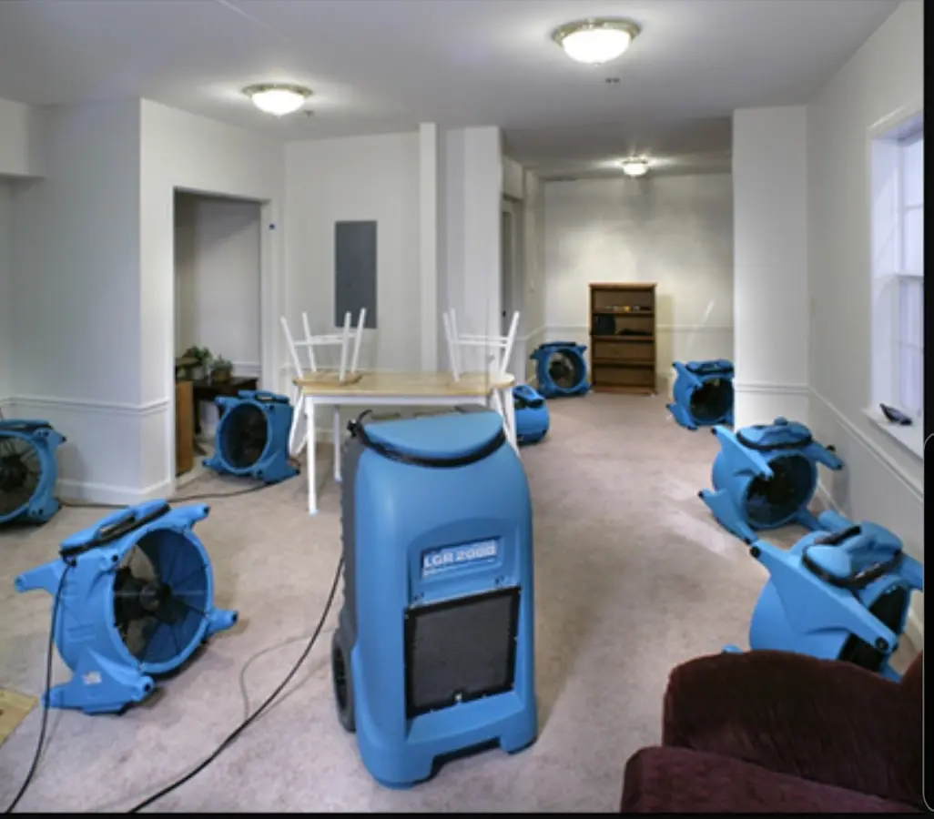 Air movers and dehumidifier setup for Water Damage Restoration in East Rochester